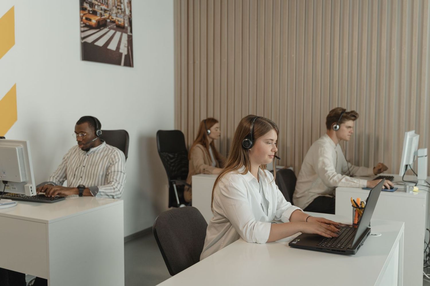A customer operations team at their desks