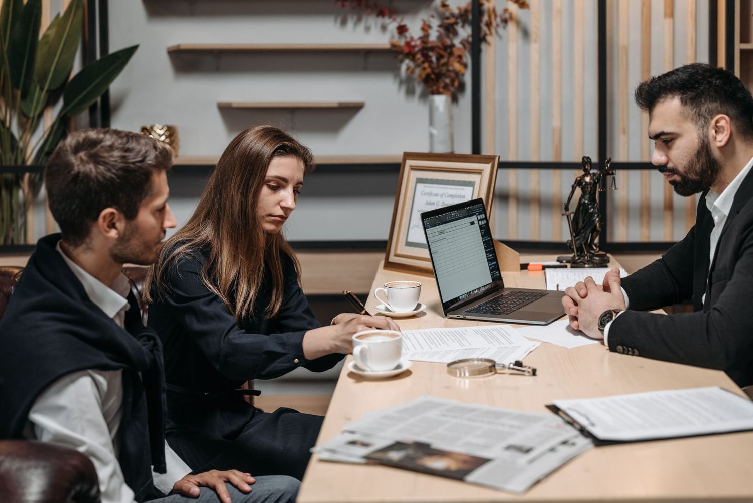 Partners discussing an agreement across a table