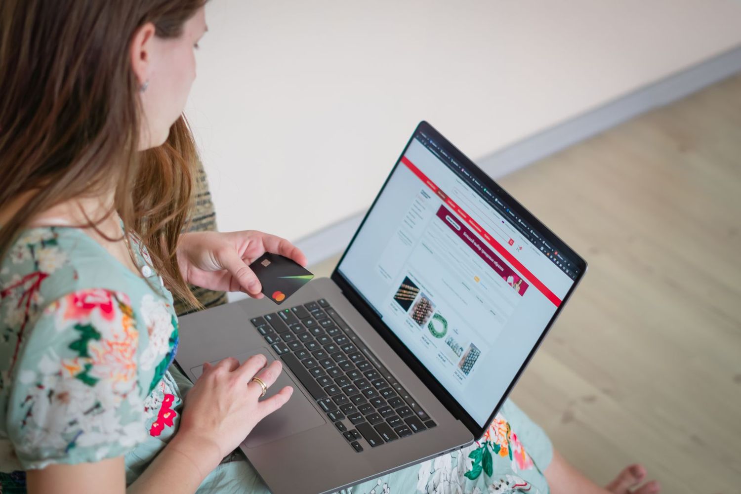 A customer shopping online on her laptop