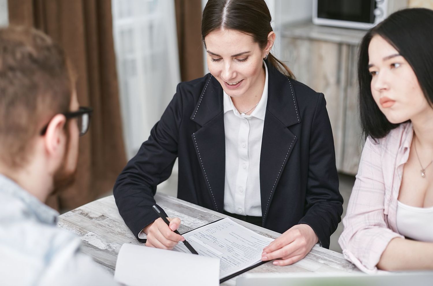Documents being reviewed and signed at a desk